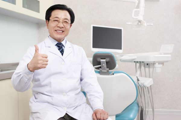 Chinese dentist in dental clinic